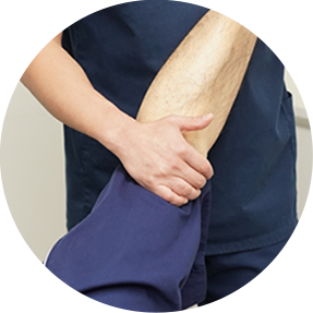 Therapist supporting the knee during a one-to-one rehabilitation session