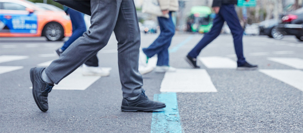 People walking across a street